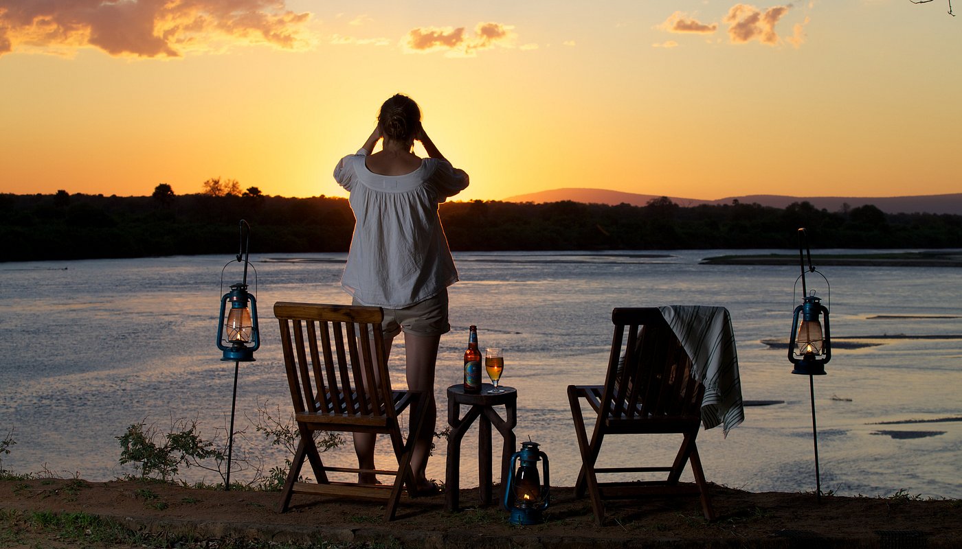 A tourist in Rufiji River Camp in the evening