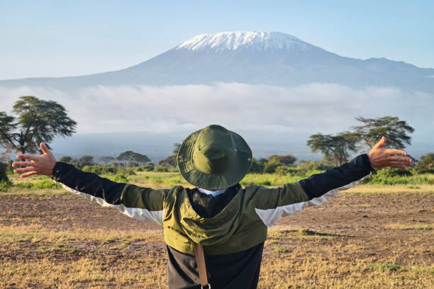 A tourist infront of Mount Kilimanjaro National Park