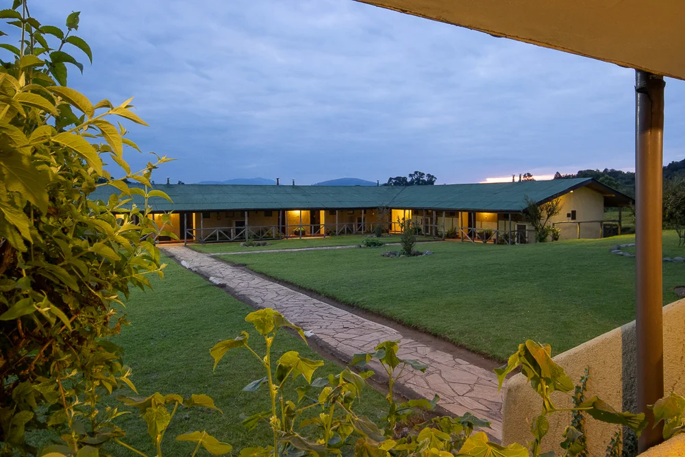 Ngorongoro Rhino Lodge exterior view of rooms in the evening Ngorongoro Rhino Lodge exterior view of rooms in the evening
